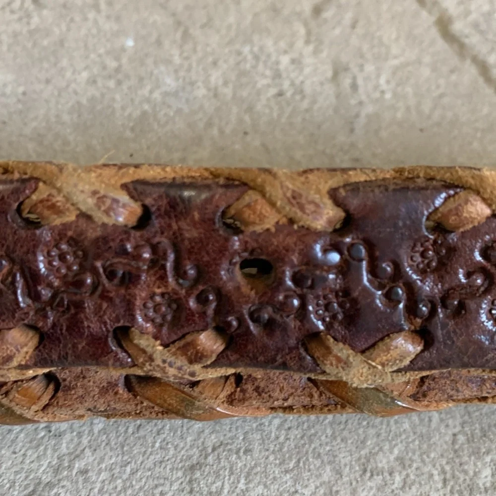 Leather tooled size small belt with wooden buckle